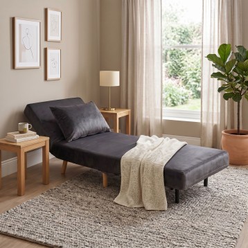 sillón cama gris oscuro ambiente 1