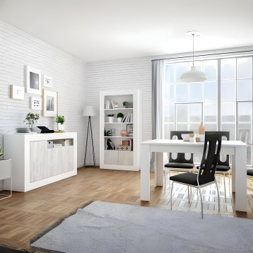 Mesa de comedor blanca rectangular con sillas negras en ambiente de sala moderno y luminoso