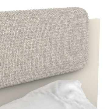 Detalle de cabecero tapizado gris texturizado y estructura blanca de madera
