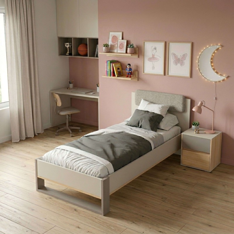 Cama infantil de madera y tapizado gris claro con cabecero textil en dormitorio rosa y escritorio integrado