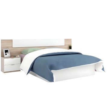 Cama doble con estructura blanca y cabecero en madera natural con mesita de noche integrada y ropa de cama azul y verde