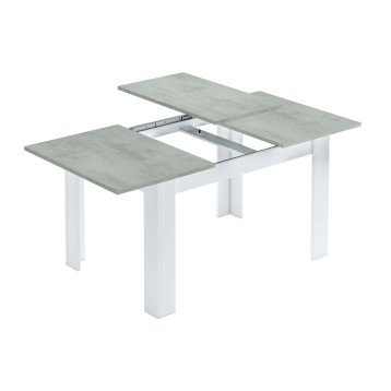 Mesa extensible con tablero efecto hormigón gris y estructura blanca con sistema de extensión visible