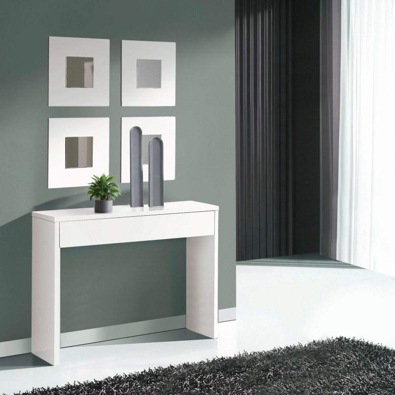 Consola blanca con cajón y estante abierto en ambiente de entrada con cuadros decorativos y plantas