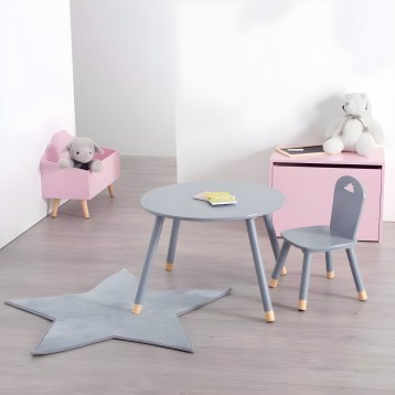 Conjunto infantil de muebles con mesa redonda gris y silla gris patas madera cajas almacenaje rosa y alfombra estrella azul