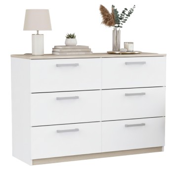 Cómoda blanca con seis cajones y encimera roble decorada con lámpara y plantas en ambiente