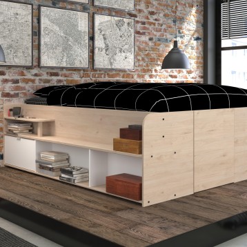 Cama nórdica de madera clara y blanca con colchón negro y almohacenaje bajo integrado en dormitorio industrial