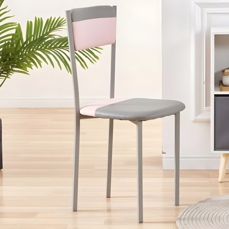 Silla de comedor con estructura metálica gris y asiento tapizado gris y respaldo rosa en ambiente interior