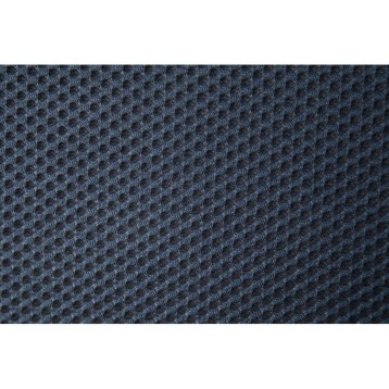 Detalle de tela tapizada azul oscuro con textura de punto acolchado y patrón geométrico