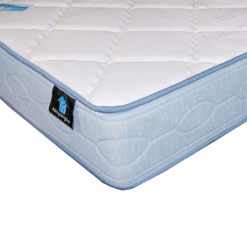 Colchón con núcleo acolchado blanco y funda azul claro con ribete azul oscuro vista de detalle lateral