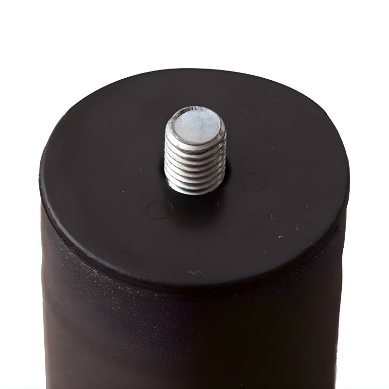 Pata de mueble cilíndrica negra con tornillo metálico en la parte superior detalle de fijación